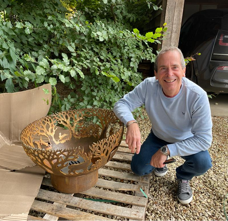 Sarj standing next to a vase on a pallet