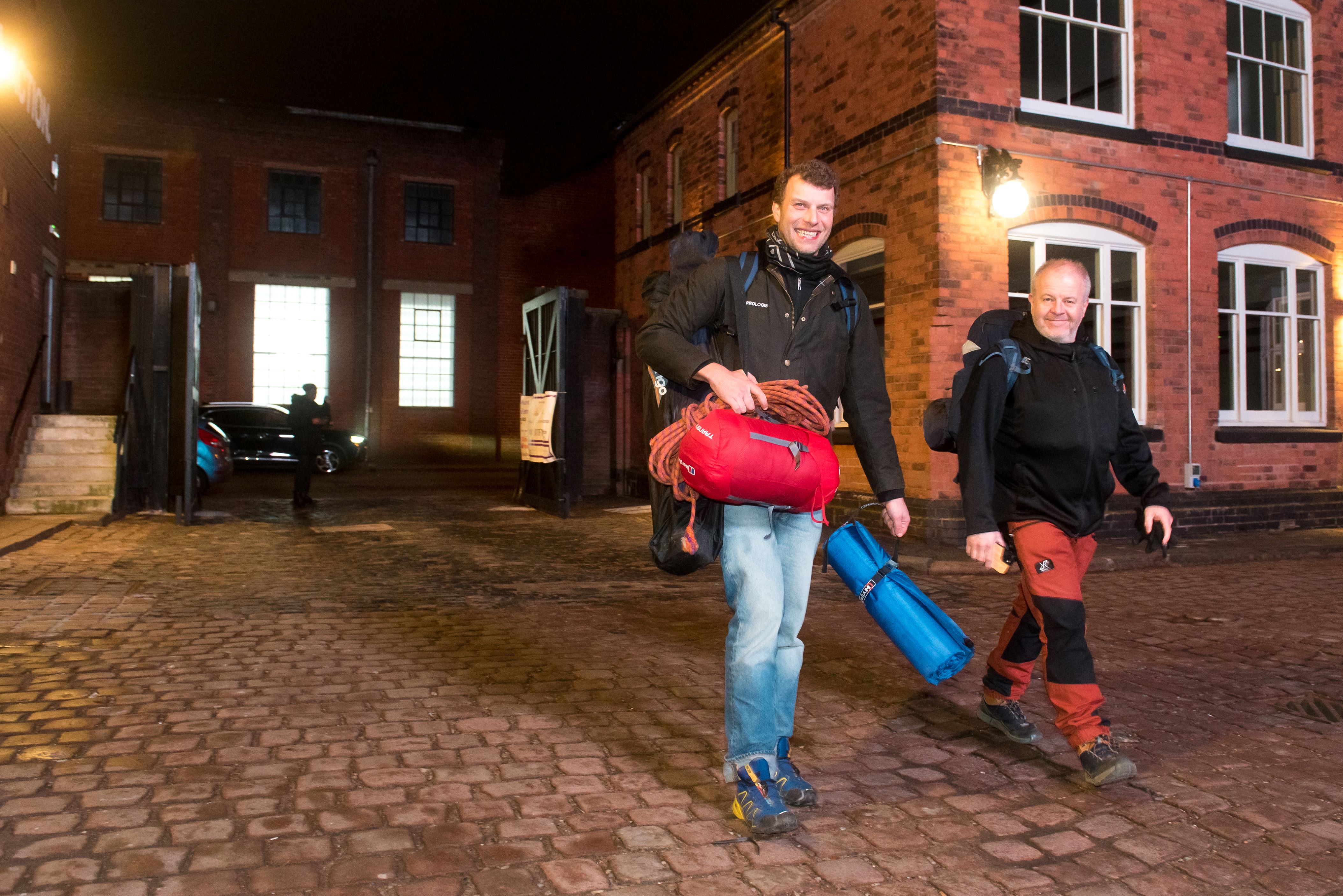 Two men walking in the evening