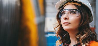 Woman with a hard hat and protective eyewear