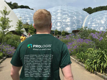 A man looking at geodesic domes wearing a Prologis shirt