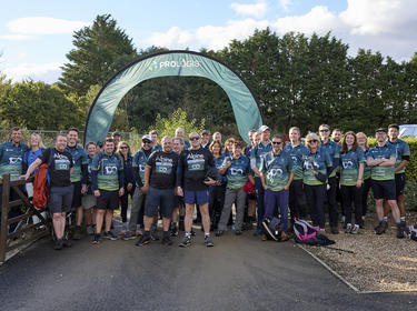 Group of charity walkers at the start line of the Prologis 100 