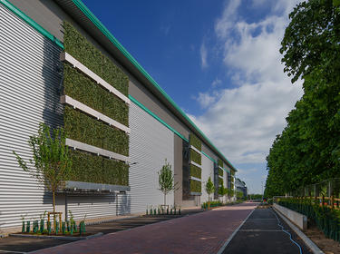 Green walls on the side of a warehouse at Prologis Park London